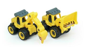 yellow plastic toy of tractor drill and bulldozer or loader isolated on white background. heavy construction vehicle. photo