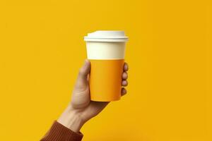 Hand holding coffee cup, yellow background. Generative AI photo