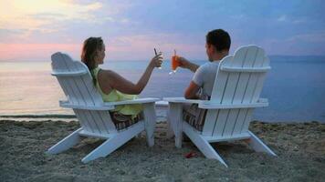Romantic couple toasting the sunset video