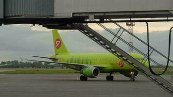 NOVOSIBIRSK, RUSSIAN FEDERATION JUNE 14, 2019 - Airbus 319 S7 Airlines VP BHG taxiing on the apron after landing, early morning. video