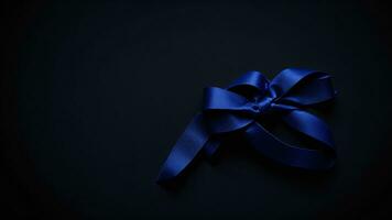 Blue satin ribbon on black background. Copy space for text. ai generated photo