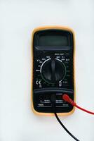 Multimeter on a white background. Voltage and current meter. photo