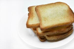 Fried toast on a white plate. Baked bread for sandwiches. Vegan food. photo