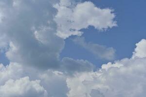 Blue-white thunderclouds in summer. Cumulative clouds. photo