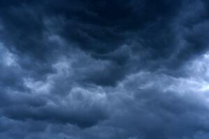 Thunderclouds in the evening sky. Cumulative clouds in a storm. photo