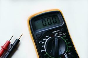 Multimeter on a white background. Voltage and current meter. photo