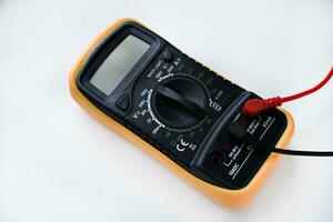 Multimeter on a white background. Voltage and current meter. photo