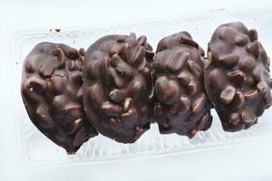 Chocolate cookies with nuts in a package. photo