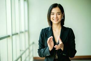 young business woman Strong energy to be successful in business, work and making money, joy, smile, confidence and good vision and a good work strategy. photo