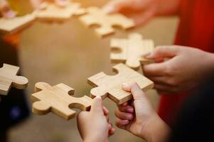 Jigsaw puzzle pieces group together, unite strength, unity, teamwork. communication connection teamwork concept photo