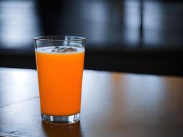 Fresh orange juice in the glass - Fresh juice on the table - photo
