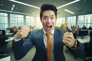 Asian Businessman Showing a Fighting Pose, Male Entrepreneur Gestures Raising Fists in Modern Office, Fights a Problem, Celebrate Success and Achieving Goals. photo