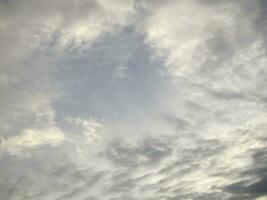 Black gray clouds form causing rain, and seasonal storms. The rain clouds that were formed caused a thunderstorm. For weather forecasters reporting the weather in the rainy season or stormy season. photo