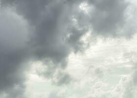 Black gray clouds form causing rain, and seasonal storms. The rain clouds that were formed caused a thunderstorm. For weather forecasters reporting the weather in the rainy season or stormy season. photo
