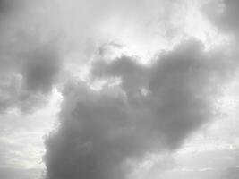 Black gray clouds form causing rain, and seasonal storms. The rain clouds that were formed caused a thunderstorm. For weather forecasters reporting the weather in the rainy season or stormy season. photo