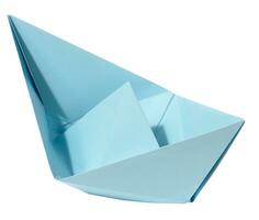 Blue paper boat on a white isolated background photo
