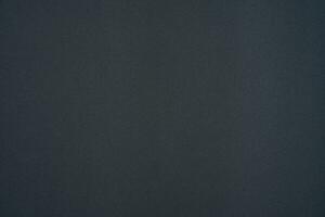 Dark gray fabric with a subtle diagonal pattern. Synthetic fabric with a slight sheen. photo