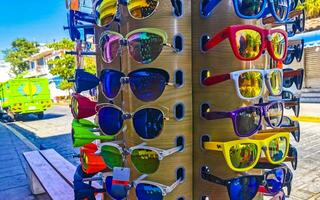 Colorful cool sunglasses at tourist sales stand in Mexico. photo