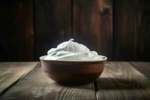 Whipped cream bowl on wood table. Generate Ai photo