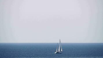 Waterscape with sea, sky and sailing yacht video