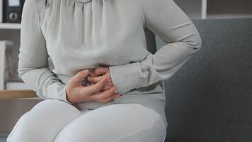 Doctor and patient sitting and talking at medical examination at hospital office, close-up. Therapist filling up medication history records. Medicine and healthcare concept. video