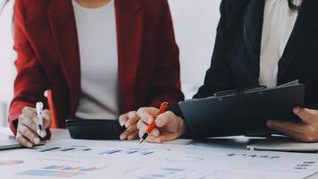 Team of business people working together in the meeting room office, teamwork background charts and graphs banner, double exposure successful teamwork,business planning concept. video