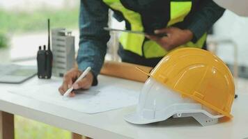 Construction and structure concept of Engineer or architect meeting for project working with partner and engineering tools on model building and blueprint in working site, contract for both companies. video