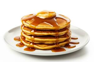 Stack of fluffy pumpkin pancakes with syrup drizzle isolated on a white background photo