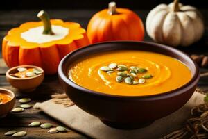 Gourmet pumpkin soup in rustic bowl background with empty space for text photo
