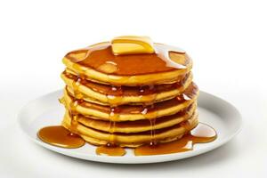 Stack of fluffy pumpkin pancakes with syrup drizzle isolated on a white background photo