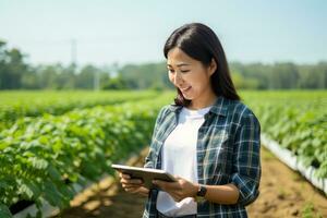 Portrait of Female Farmer Using Tablet in the Farm, Observes and Check Growth Plants, Agriculture Smart Farming Concept photo
