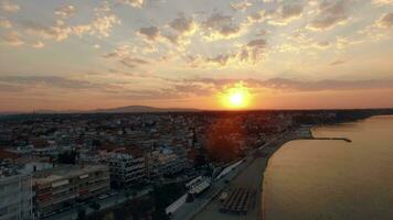 Aerial scene of coastal resort town at sunrise Nea Kallikratia, Greece video