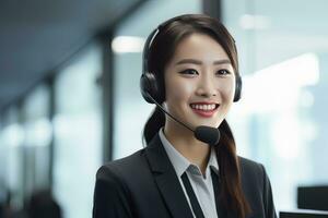 Portrait of a Beautiful Asian Customer Service Operator, Call Center Worker Talking Through Headset with Customer in Modern Office. photo