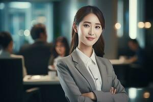 Portrait of a Beautiful Businesswoman in Modern Office, Asian Manager Looking at Camera and Smiling, Confident Female CEO Planning and Managing Company. photo
