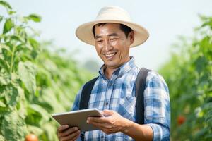 Portrait of Male Farmer Using Tablet in the Farm, Observes and Check Growth Plants, Agriculture Smart Farming Concept photo