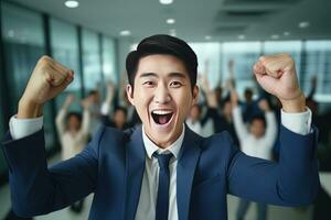 Happy Successful Asian Businessman Celebrating in Modern Office, Celebrate Success and Achieving Goals, Male Entrepreneur Celebrate Winning Moments. photo