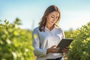 Portrait of Female Farmer Using Tablet in the Farm, Observes and Check Growth Plants, Agriculture Smart Farming Concept photo