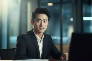 Portrait of a Handsome Businessman in Modern Office, Asian Manager Looking at Camera and Smiling, Confident Male CEO Planning and Managing Company Strategy. photo