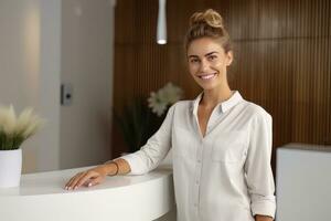 Portrait of Smiling Receptionist Female Greeting Client, Happy Business Woman Reception in Modern Office photo