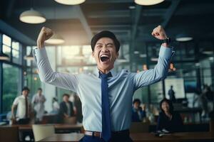 Happy Successful Asian Businessman Celebrating in Modern Office, Celebrate Success and Achieving Goals, Male Entrepreneur Celebrate Winning Moments. photo