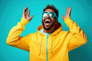 Portrait of Cheerful Man Wears Sport Fashion, Happy Sporty Male Smiling on Studio Background, Winner Gesture Celebrating. photo