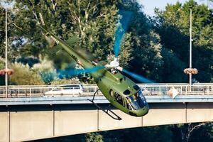 Hungarian Air Force Eurocopter AS350 Ecureuil military utility helicopter. Flight operation and rotorcraft. Transport and airlift. Fly and flying. photo