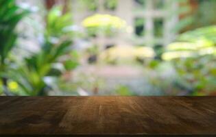 Empty dark wooden table in front of abstract blurred bokeh background of restaurant . can be used for display or montage your products.Mock up for space. photo