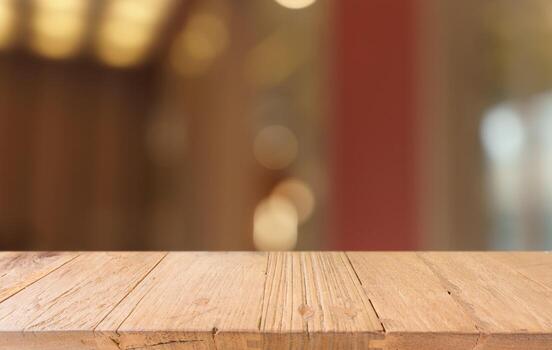 Mock up for space. Empty dark wooden table in front of abstract blurred bokeh background of restaurant . can be used for display or montage your product photo