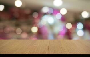 Empty wooden table in front of abstract blurred background of coffee shop . can be used for display or montage your products.Mock up for display of product photo