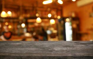 Empty wooden table in front of abstract blurred background of coffee shop . can be used for display or montage your products.Mock up for display of product photo