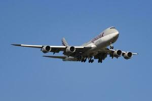 Qatar Airways Cargo Boeing 747-8 Jumbo Jet A7-BGA cargo plane arrival and landing at Luxembourg Findel airport photo