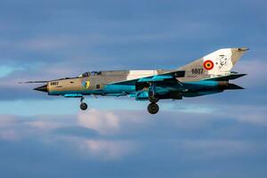 MiG-21 military fighter jet plane at air base. Air force flight operation. Aviation and aircraft. Air defense. Military industry. Fly and flying. photo