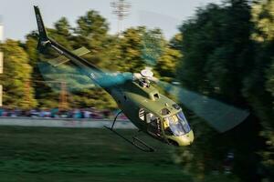 Hungarian Air Force Airbus Helicopters Eurocopter AS350 H125M Ecureuil 102 military helicopter flying over Szolnok city downtown photo