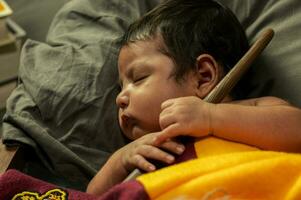 New Born session with a baby child sleeping quiet photo